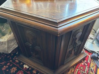 End table with wood carving