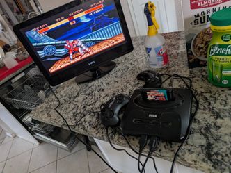 Sega genesis 5 games 2 controllers testing available in front of you