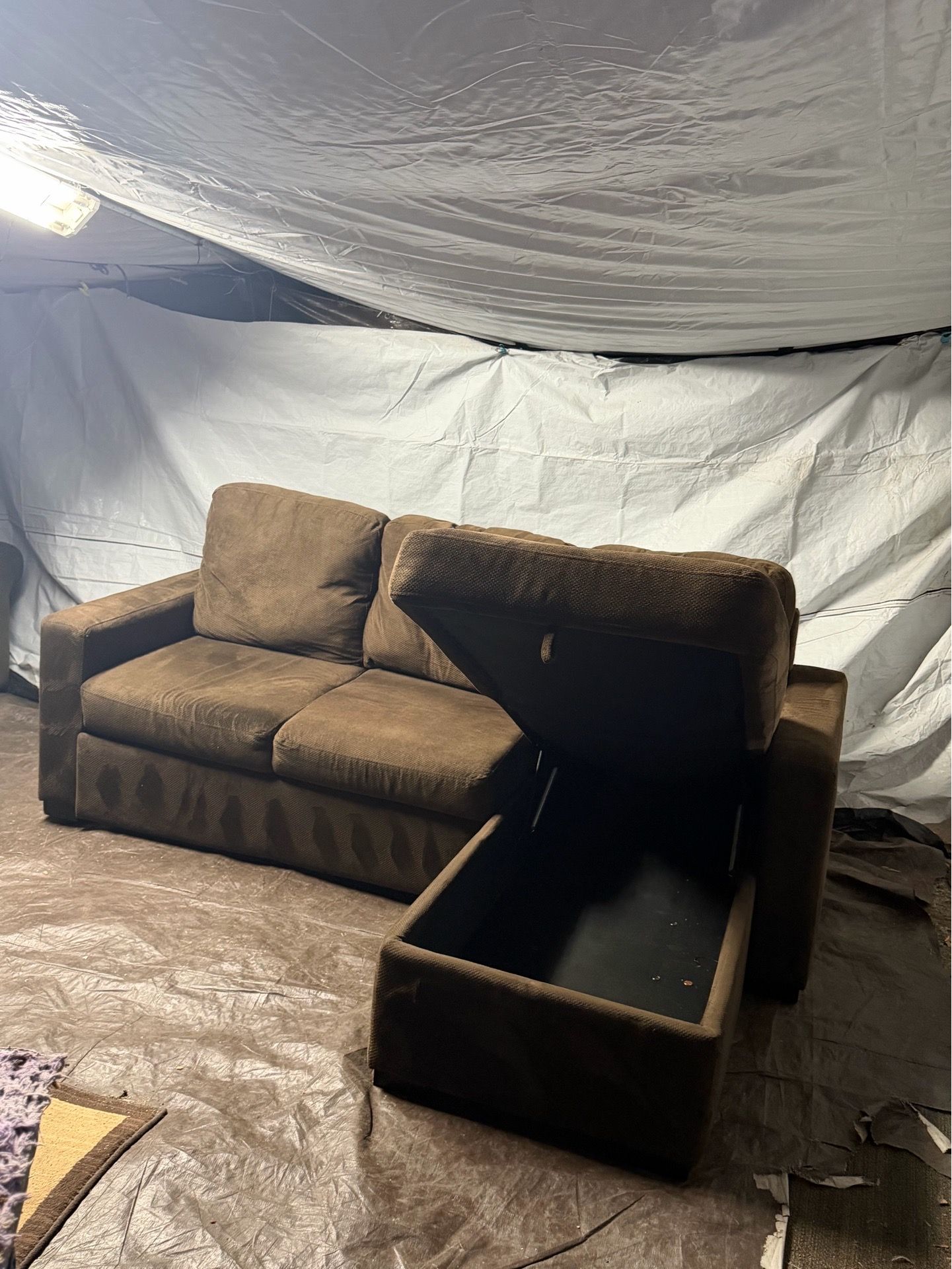Brown couch with bed and storage ottoman good condition clean we sell all the time delivery $40 local