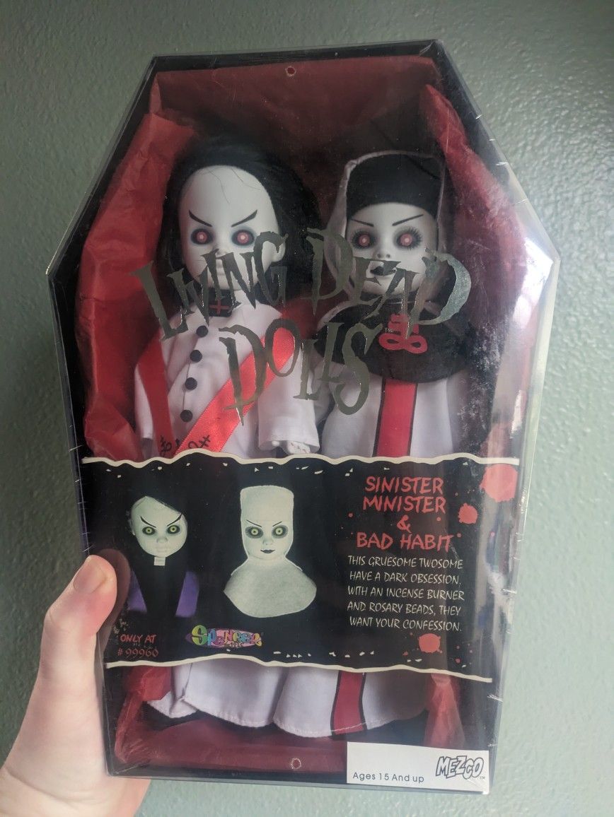 New in original sealed packaging. Sinister Minister and Bad Habit living Dead Dolls.