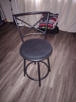 Three black medal and fabric bar stools
