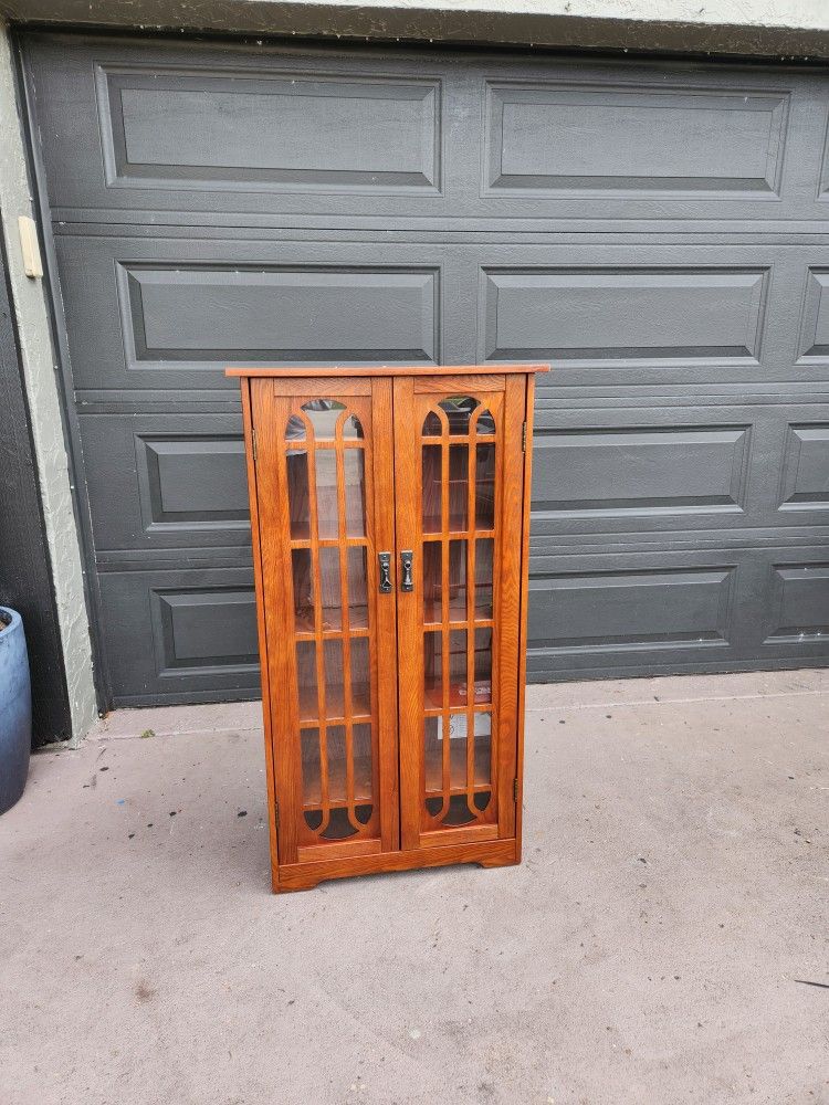 Wood and Glass Media cabinet with 6 shelves
48"T X 26"W X 9"Deep read description for details