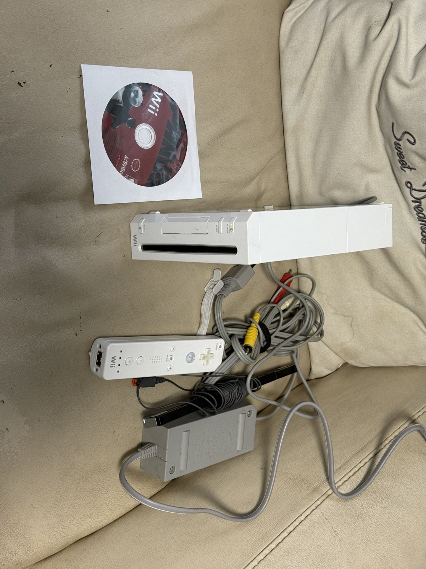 Nintendo Wii With All Cords , Controller And A Game