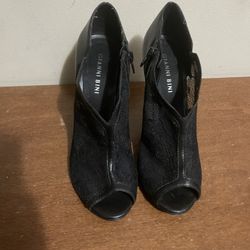 Size 6 1/2 black lace, peep toe booty high heels With side zip  By Gianni Bini 