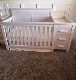 Convertible crib with changing table