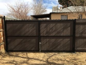 Wood fence and open swing double doors