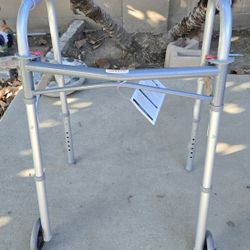 New, Deluxe Drive walker W/5" wheels