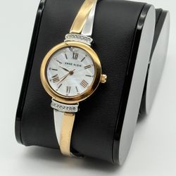 Anne Klein 2 tone gold and silver color watch, 26mm size case, 7in or 6in size wrist sizable 