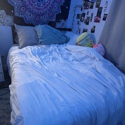 Queen Size Bed And A Black Frame 