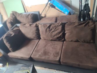 Brown sectional couch with ottoman