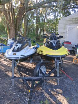 2 jetskis and double trailer