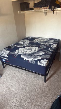 Queen sized Sleepys  Hybrid mattress. Like new. Floor model. Adjustable motorized bed frame included