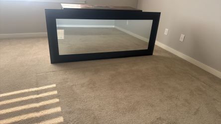 6ft mirror with unique frame with hanging hardware on the back