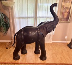 GIANT LEATHER-WRAPPED TRUNK UP ELEPHANT STATUE