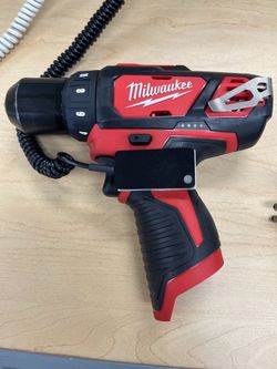 Milwaukee drill 2 batteries one charger.
