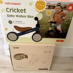 Two brand new toddler trikes