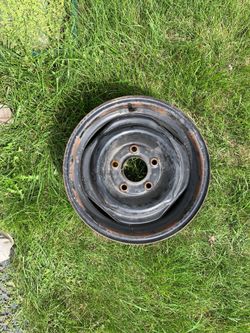 1974 chevy hub caps and 4 - 14 inch steel wheels