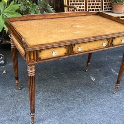 Gorgeous Vintage Writers Desk with Leather Embossed Surface on Casters. 