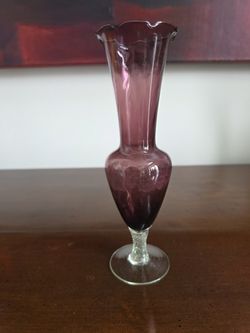 Hand-blown amethyst glass bud vase with ruffled rim and clear stem