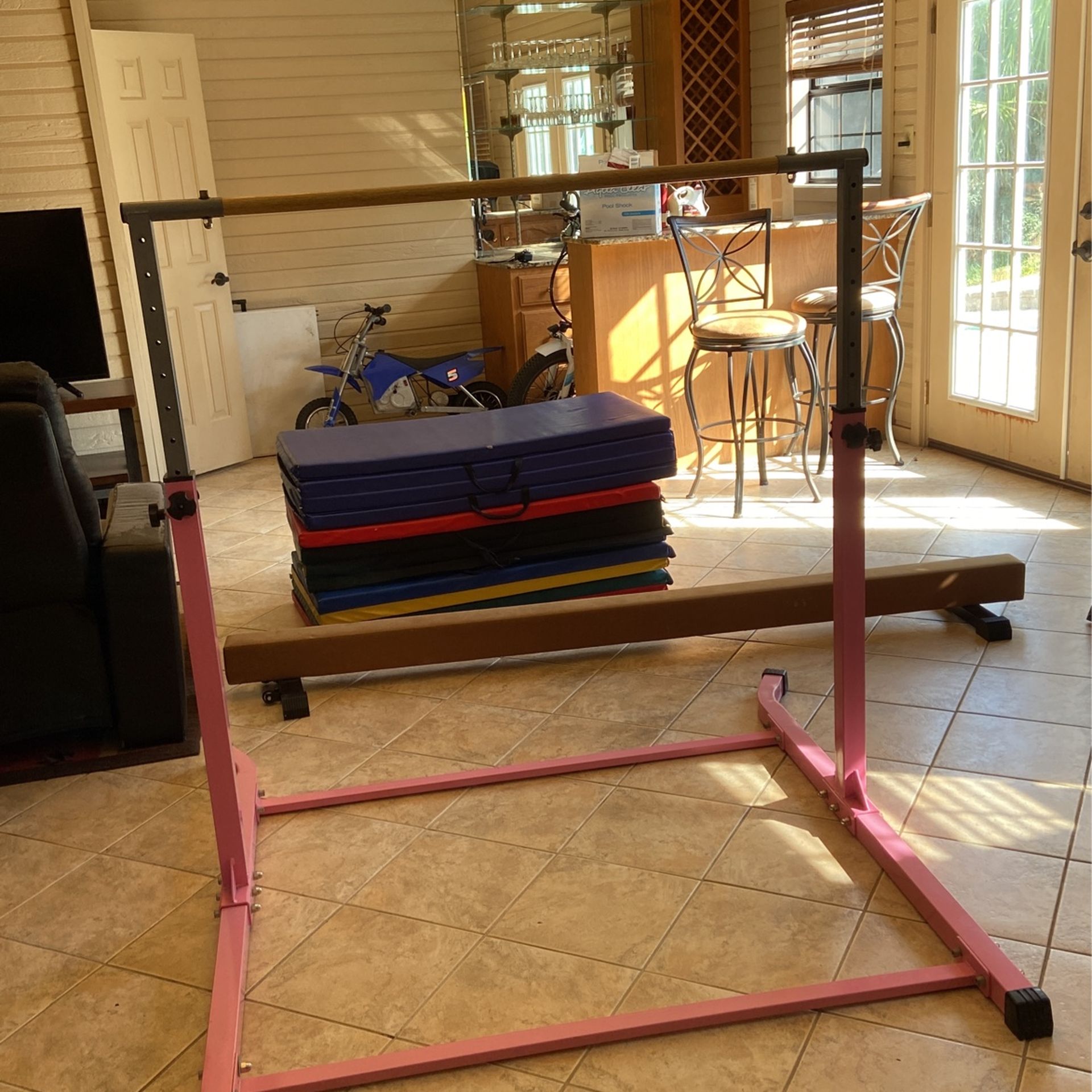 Gymnastics Bar, Balance Beam, And Mats