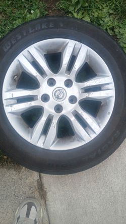 2 Rims and tires off 2010 Nissan