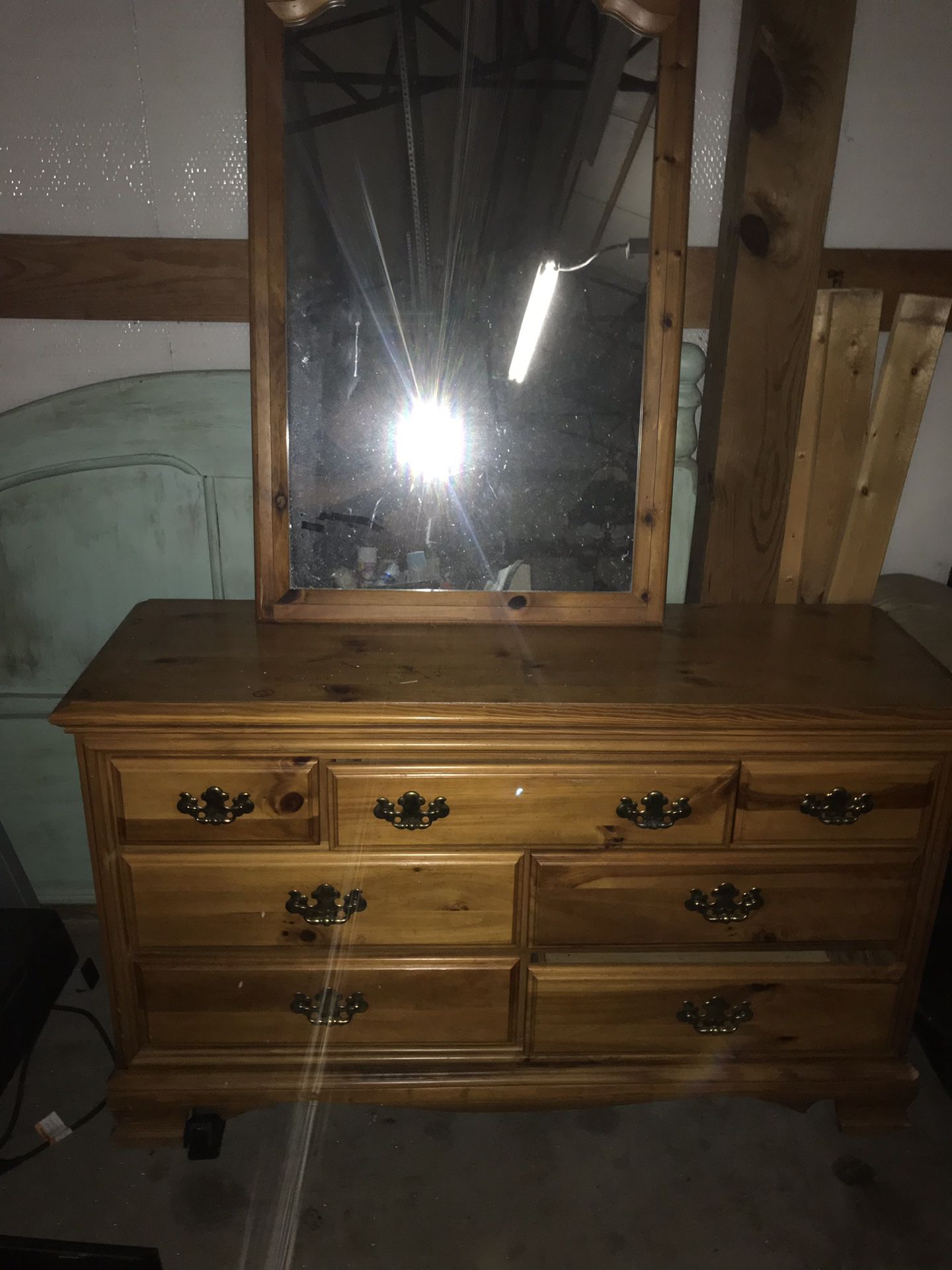 Well kept hardwood dresser and mirror