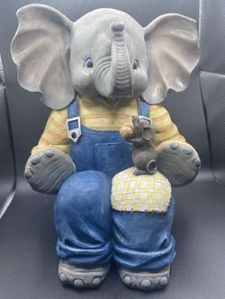 Elephant With A Mouse Holding Peanut 