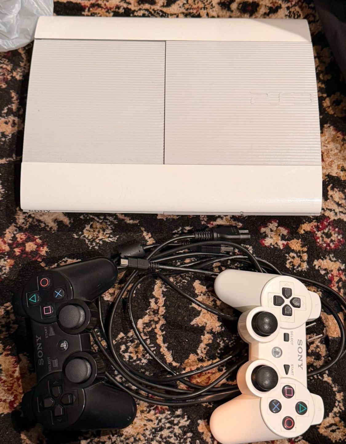 PS3 Console With Two Controllers And Several Games