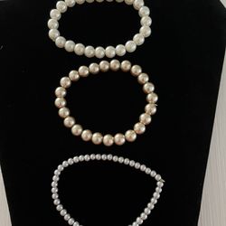 Costume jewelry faux Pearl bracelets.