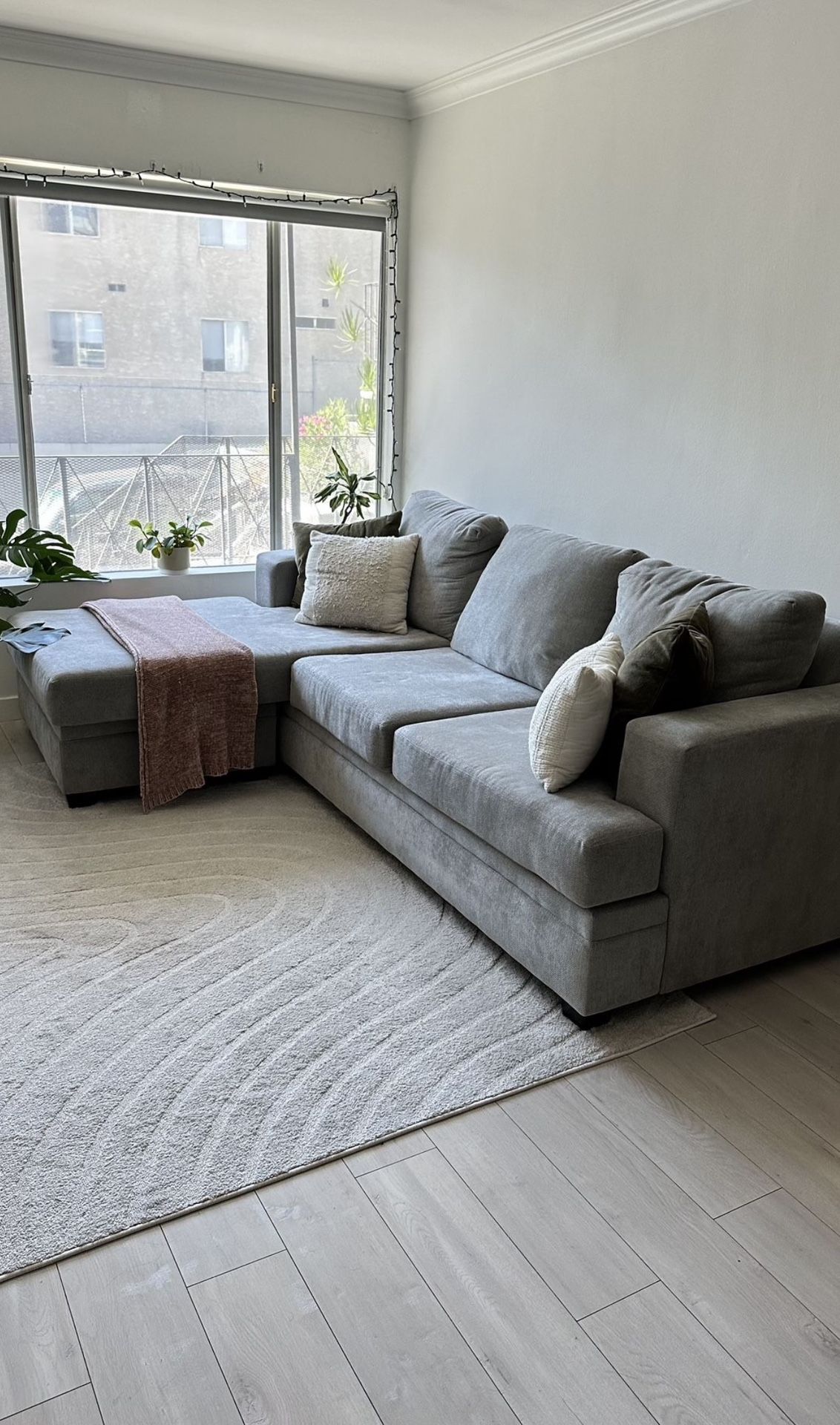 Living Spaces Grey Sectional Sofa with reversible chaise