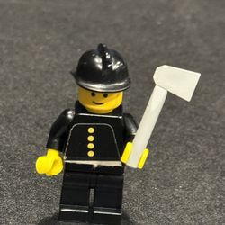  Vintage Lego fireman minifigure From Lego Set 620. Stickered Torso. Includes Helmet. Rare Piece. Good used condition.   This vintage Lego fireman min