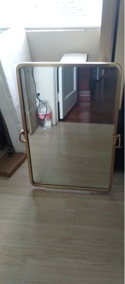 Large rectangular pivot mirror gold trim