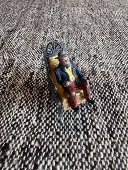 Hollowcast Miniature Villager in chair antique/vintage