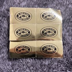 VINTAGE a set of six gold-colored tickets from the 1998 Fairbanks Carnival celebrating its 50th anniversary. 