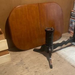Mahogany dining table with attached two leaves