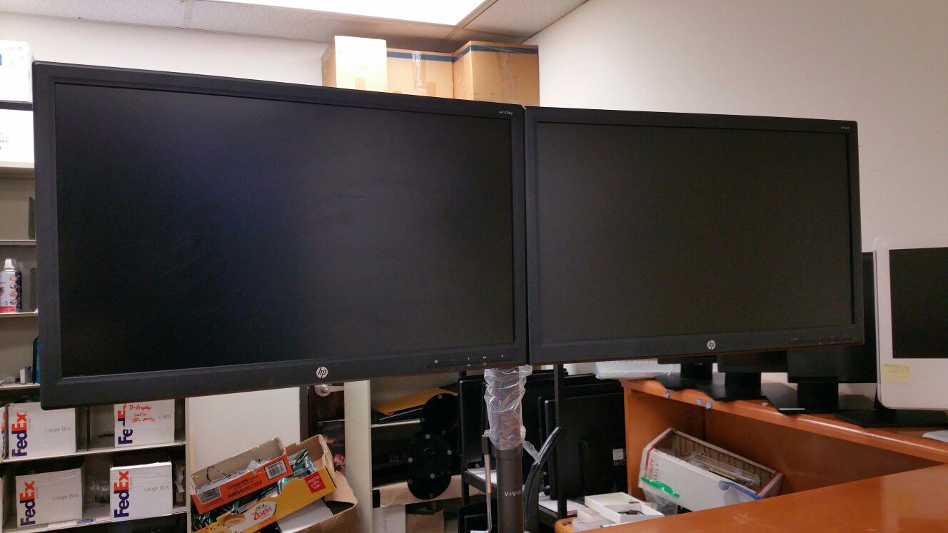 Dual-armed stand and Two HP 23" LED monitors on one stand with cables