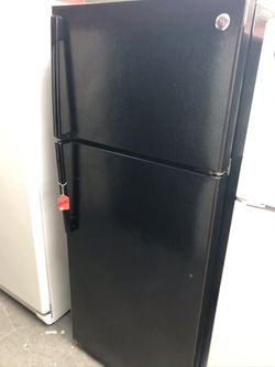 Used GE 16 cu ft top and bottom fridge. 1 year warranty