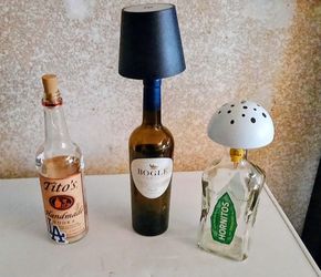 Multiple refurbished Glass Bottle lamps