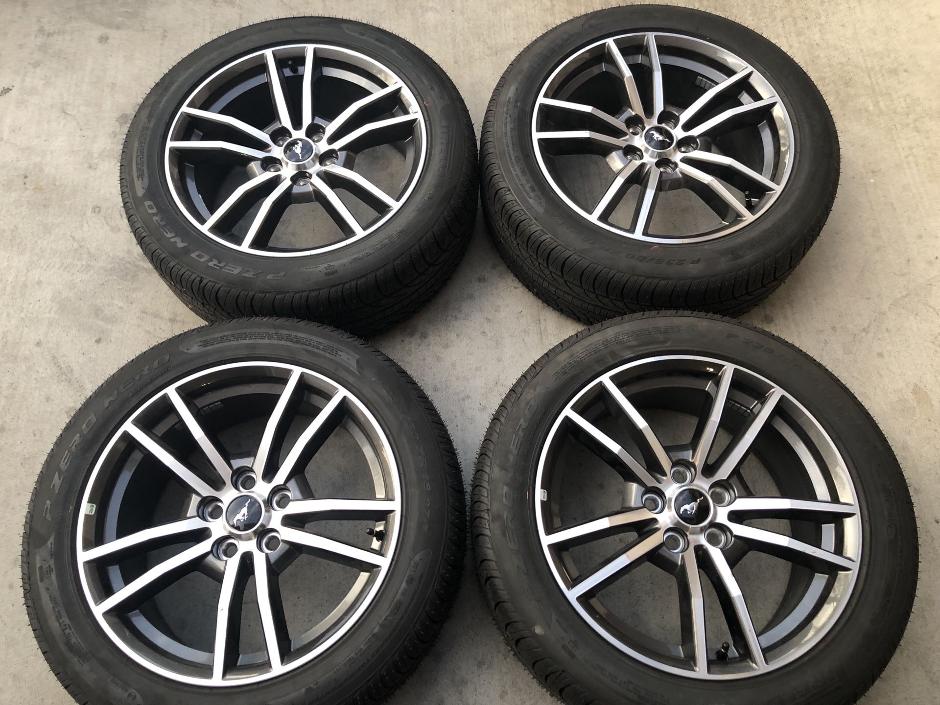 Factory brand new 18 inch Ford Mustang wheels and tires with a pirelli 235/50/18 tires asking $600