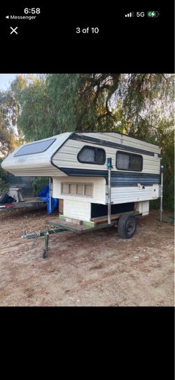 SMALL CAMPER ON TRAILER