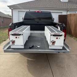 Decked sliding system with weather guard tool box.