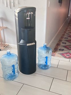Bottom loader, water dispenser, and 5 gallon water jugs Bottom loader, water dispenser, and 5 gallon water jugs