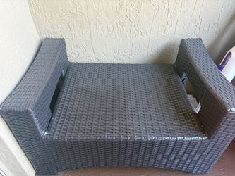 Dark grey wicker outdoor chair