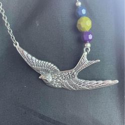 Gunmetal gray sparrow in flight necklace