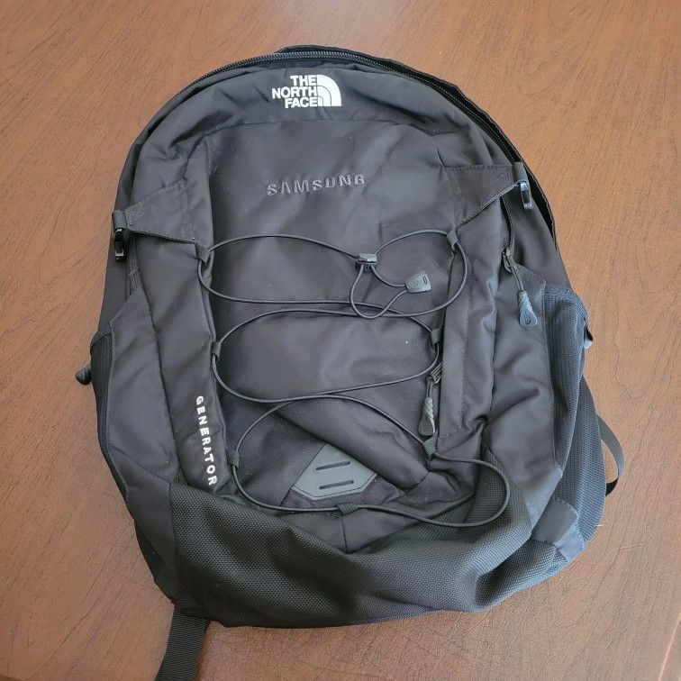 The North Face Generator Backpack Black Holds 15” Laptop. Perfect shape,
like new, no tags. Never been used.
It has embroidered " Samsung" on the fro
