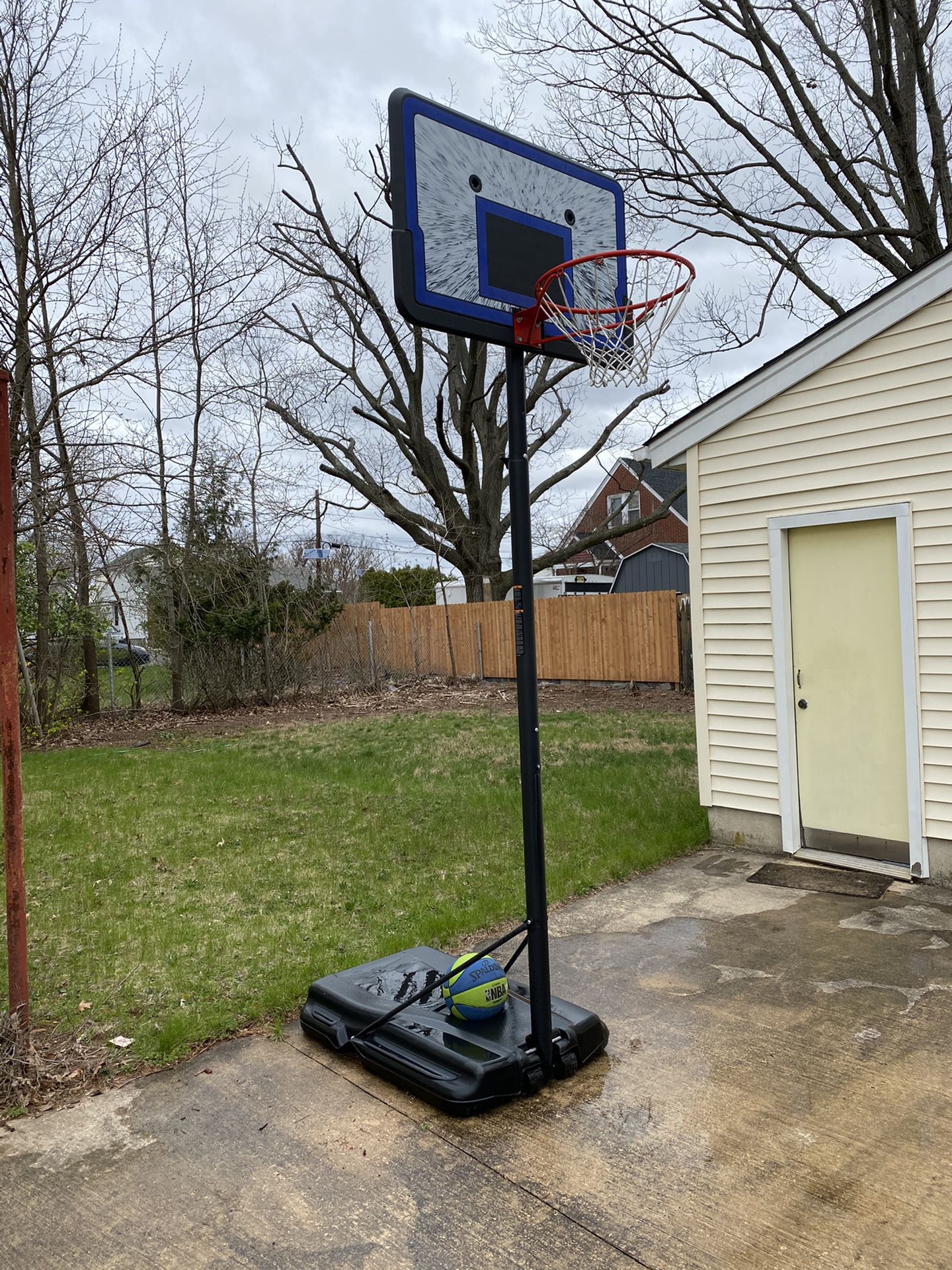 Portable height adjustable basketball hoop and basketball