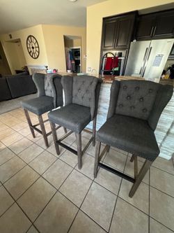 Set of 3 wingback barstools.