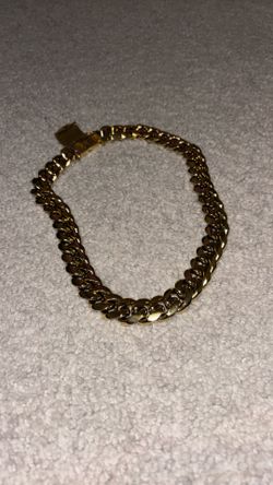 14 karat gold 19 mm thick 20 mm long go to Miami Cuban