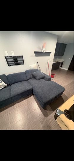 GREAT CONDITION DARK BLUE LARGE U-SHAPED COUCH WITH PILLOWS. Couch can be re-organized and has storage compartment!