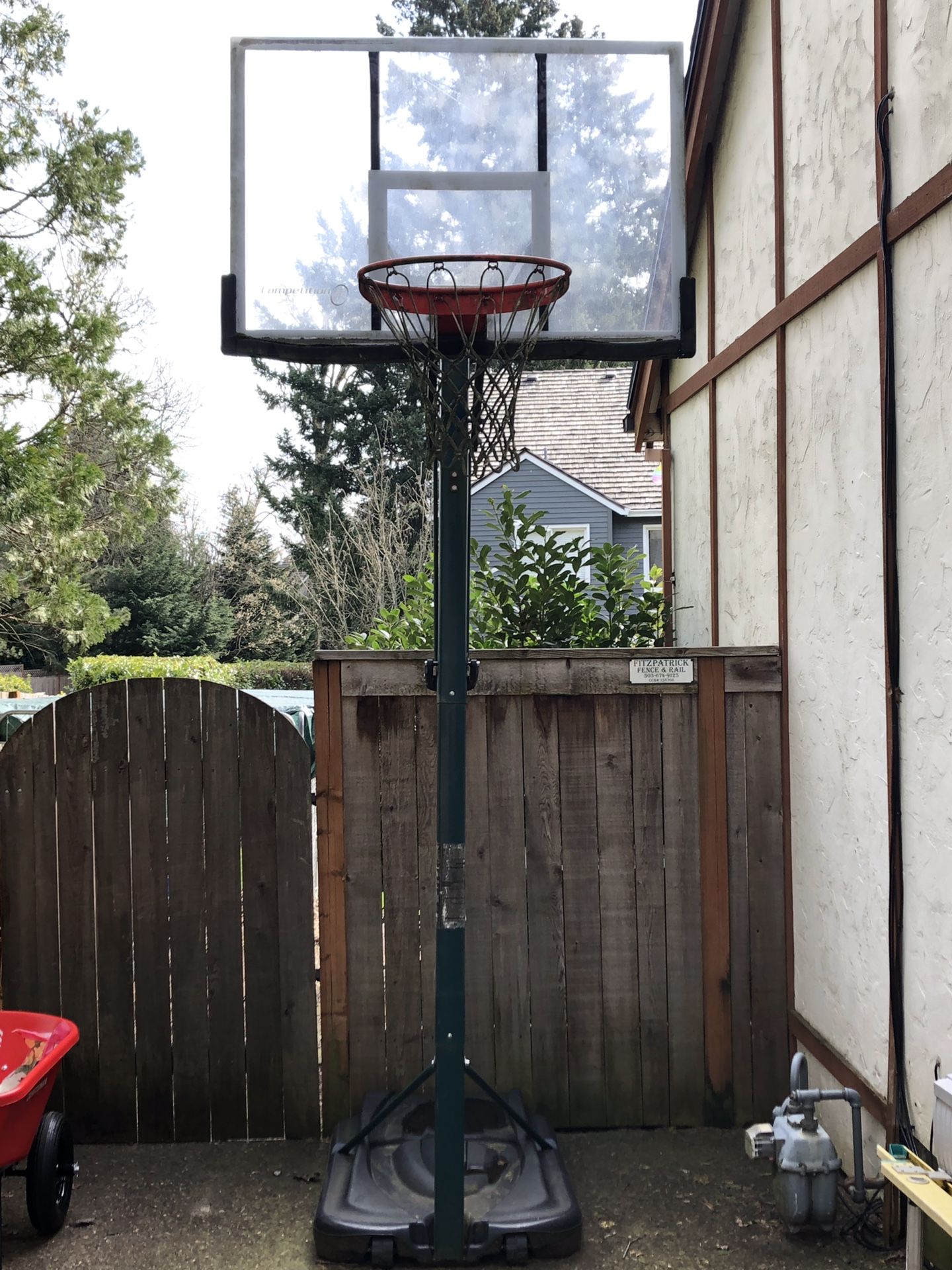 Moveable/adjustable basketball hoop. Glass backboard. Great shape! 200.00